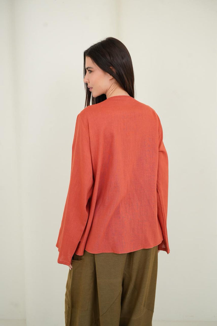 Orange ruffled muse blouse