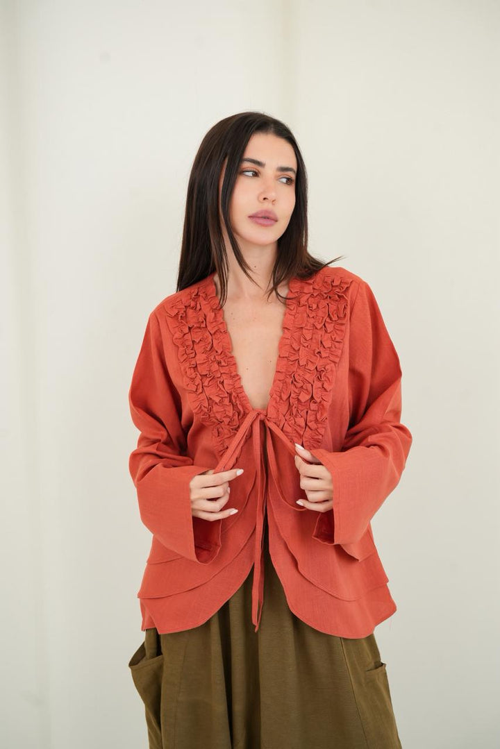Orange ruffled muse blouse