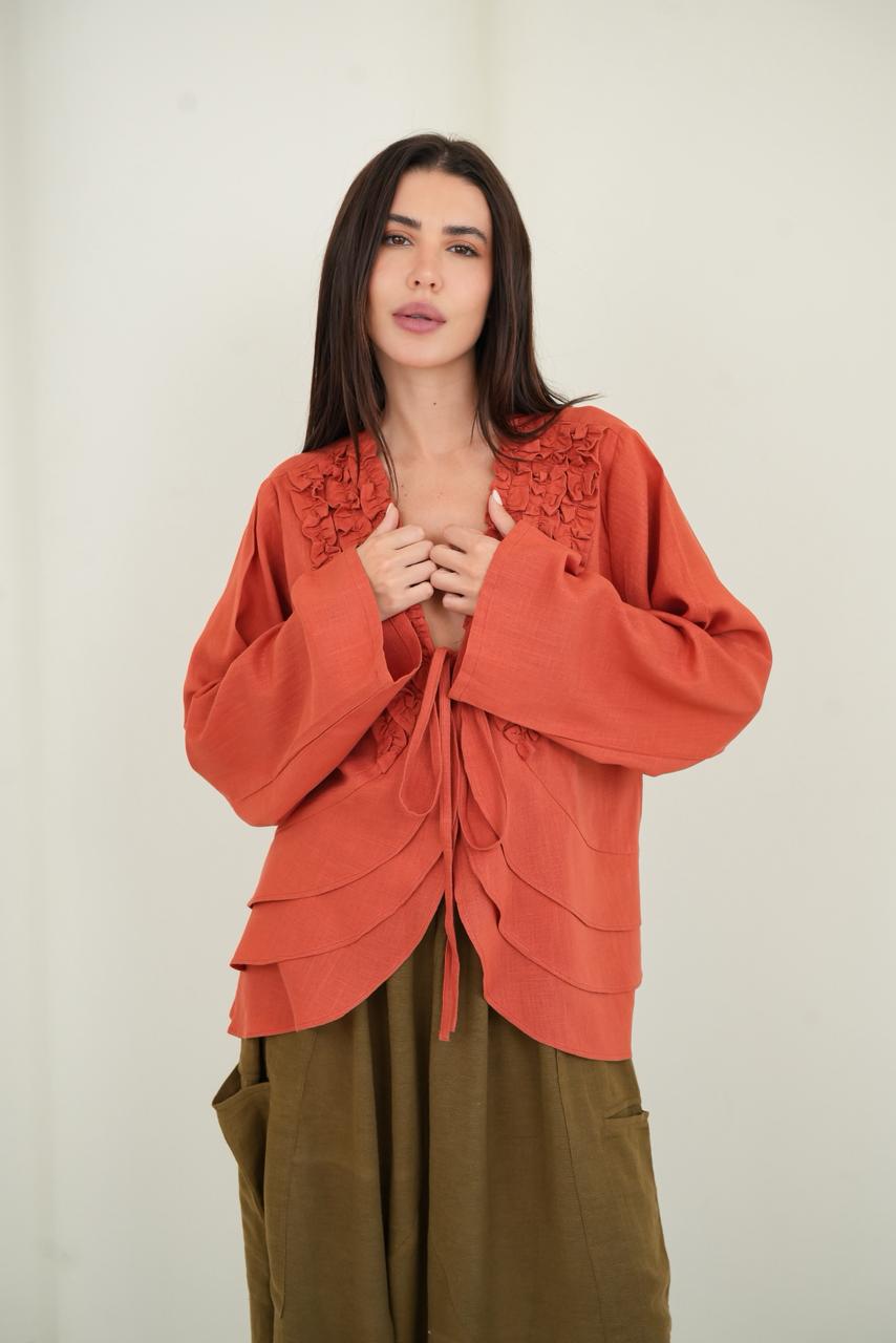 Orange ruffled muse blouse