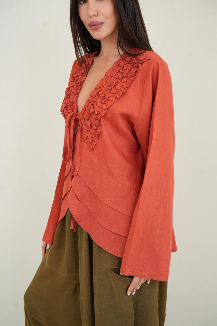 Orange ruffled muse blouse