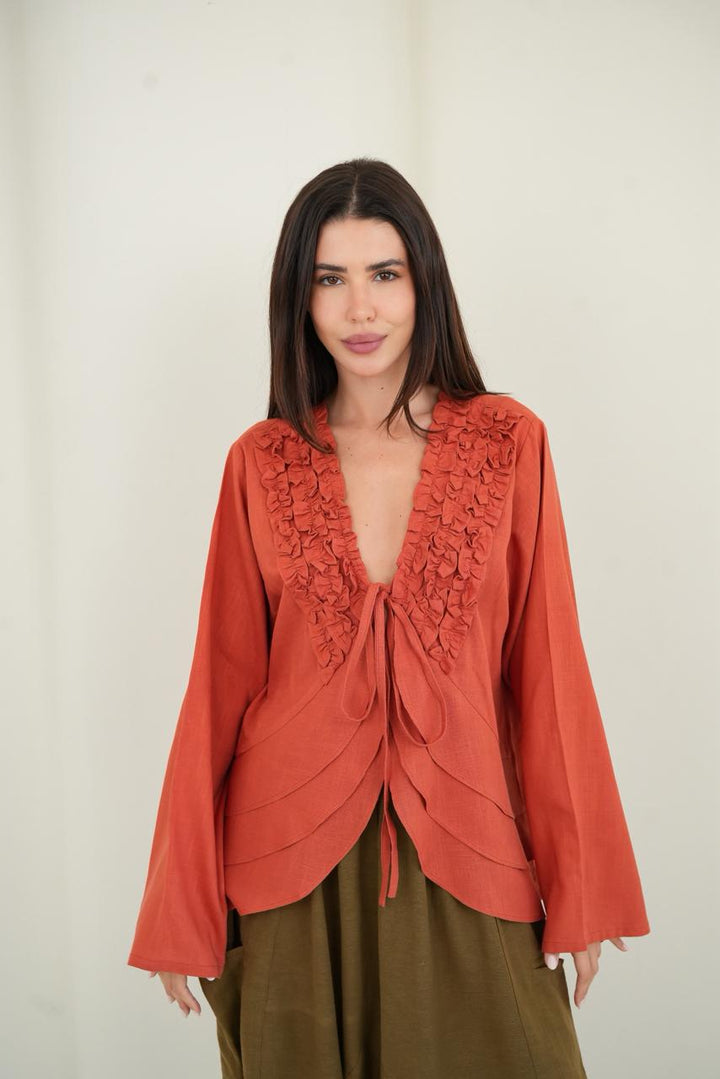 Orange ruffled muse blouse
